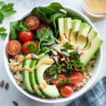 🌱 Satisfy your taste buds with this plant-based quinoa bowl! Packed with veggies, protein, and a creamy tahini dressing, it’s the perfect quick and healthy meal. 🥑🍋