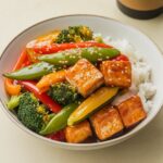 Tofu Stir-Fry Fiesta 🌱: A quick and healthy protein-packed vegan recipe with tofu and vibrant veggies, perfect for weeknight dinners. Ready in just 25 minutes!